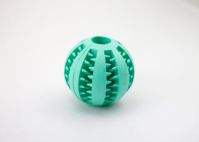 Bright green rubber pet toy ball with textured spikes and ridges for dental cleaning and food dispensing. - Image 9