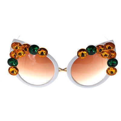 White cat-eye sunglasses with brown gradient lenses, adorned with clear and amber rhinestone flowers and bees. - Image 4