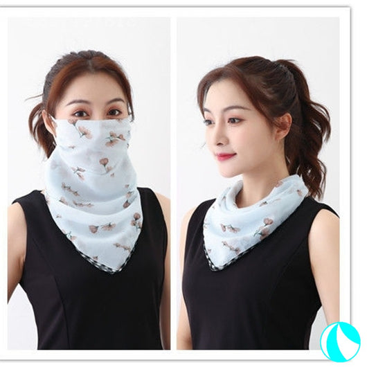 White women's UV protection scarf with black speckle pattern, worn as a face mask and neck scarf. - Image 4