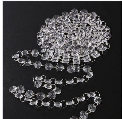Coiled strand of clear faceted acrylic beads linked with silver rings, ideal for DIY curtains or wedding decor. - Image 4