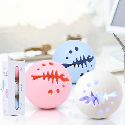 Three-pack of cat toy balls, including a pink fishbone-patterned ball, a mint ball, and a flashing ball. - Image 4