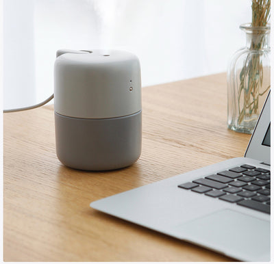 Coral desktop humidifier with a modern cylindrical design, featuring a green indicator light and a power button. - Image 5