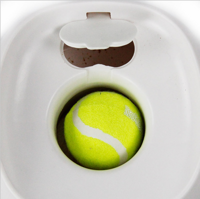 AFP Fetch'N Treat interactive dog toy, a white and green machine that dispenses treats with a tennis ball. - Image 3