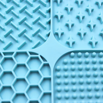 Gray silicone pet licking pad with four textured sections, designed for slow feeding and anti-choking. - Image 46
