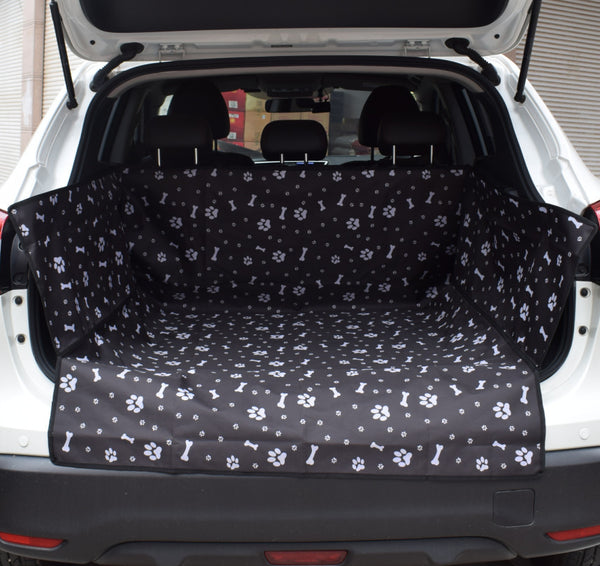 Blue waterproof pet car mat with white paw print and bone patterns installed in the trunk of a white SUV. - Image 3
