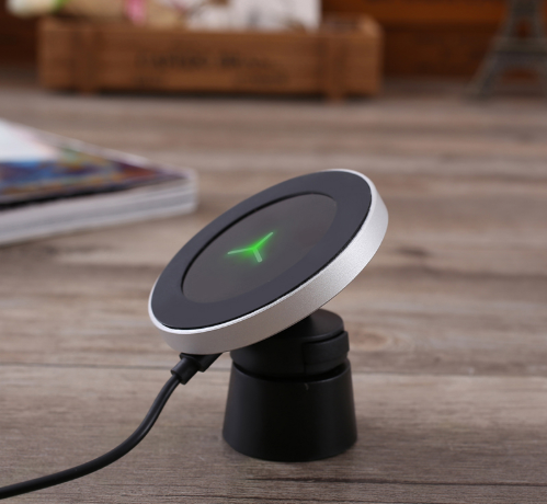 Silver and black car magnetic wireless charger with a blue indicator light, mounted on a car's air vent. - Image 5