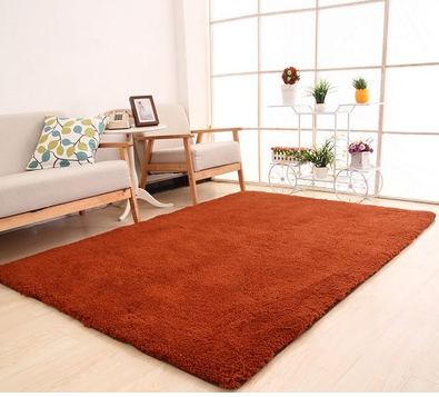Fluffy purple rectangular area rug on a light wood floor in a modern living room with a sofa and plant stand. - Image 3
