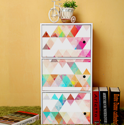 White PVC self-adhesive wallpaper with a playful pattern of hand-painted style polka dots in red, yellow, teal, and purple.