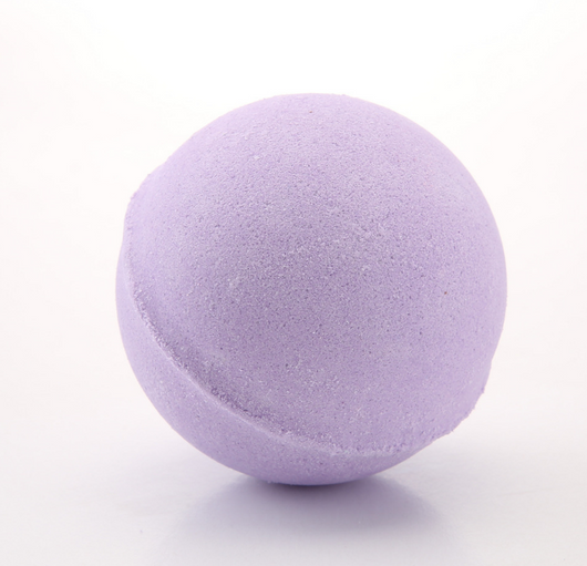 A single, round, light green bath bomb with a slightly textured surface, ready for a relaxing bath. - Image 9