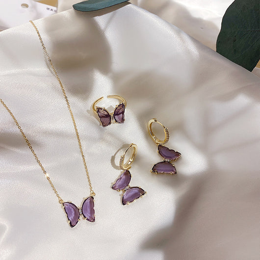 Aretes, Anillo y Collar de Cristal Púrpura con Diseño de Mariposa - Image 6