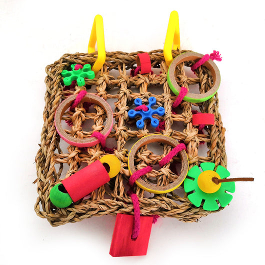 Colorful parrot bite toy with a woven grass mat, yellow plastic hangers, and various red, green, blue, and brown chewable components. - Image 3