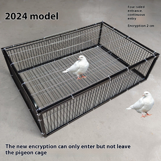 Black wire pigeon cage with a flat top and bottom, designed for one-way entry, shown on a gray surface.