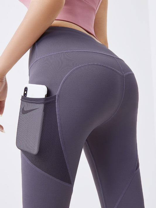 Pantalones fitness ajustados con bolsillos de malla lateral