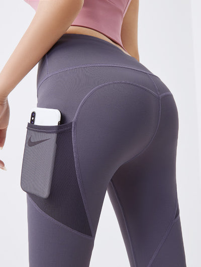 Pantalones fitness ajustados con bolsillos de malla lateral