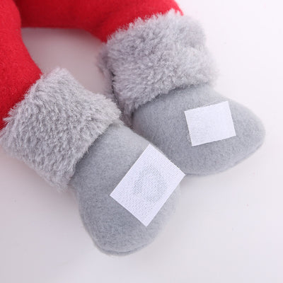 Plush Santa Claus curtain tie-back with a red and grey knitted hat, white beard, and red body, holding a golden curtain. - Image 2