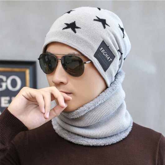 Brown knitted beanie with white five-pointed stars and a matching fleece-lined neck warmer on a man. - Image 3