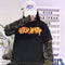 Suéter Holgado Estilo Coreano con Mangas Camuflaje y Estampado de Letras