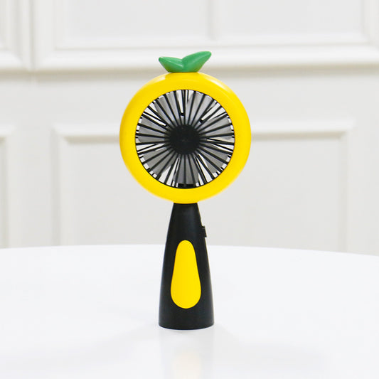 White and lime green children's handheld fan with a round head, small leaf accent, and fruit-like design. - Image 2