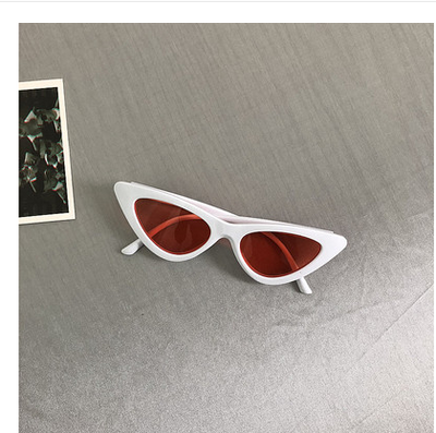 Retro cat-eye sunglasses with a tortoiseshell frame and dark lenses, ideal for a stylish, vintage look. - Image 21
