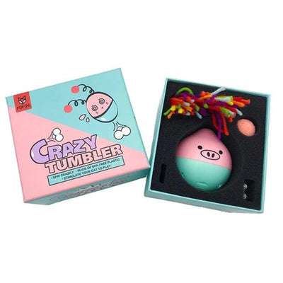 Pink and mint green pig-shaped tumbler pet toy with a colorful yarn tassel and spring, shown with its box. - Image 4