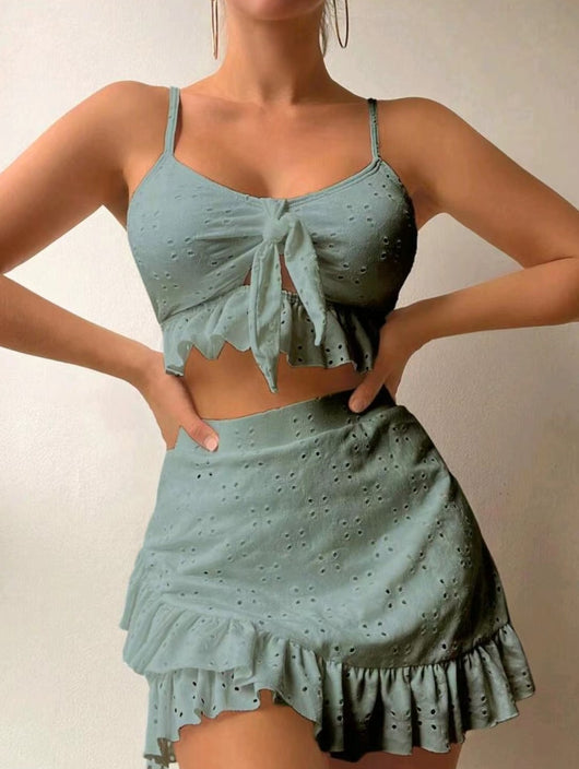 Light blue eyelet two-piece swimsuit set with a tie-front crop top and a matching ruffle-trim hip-hugging skirt. - Image 6