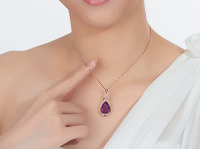 Rose gold necklace with a teardrop purple gemstone pendant and matching dangle earrings. - Image 18