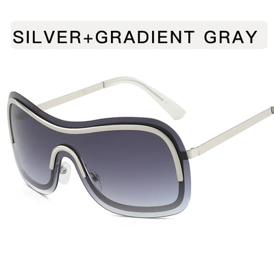 Women's fashionable shield sunglasses with a gold metal frame and dark gray lenses, featuring a unique wavy design. - Image 10