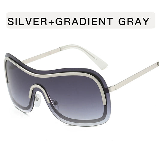 Women's fashionable shield sunglasses with a gold metal frame and dark gray lenses, featuring a unique wavy design. - Image 10