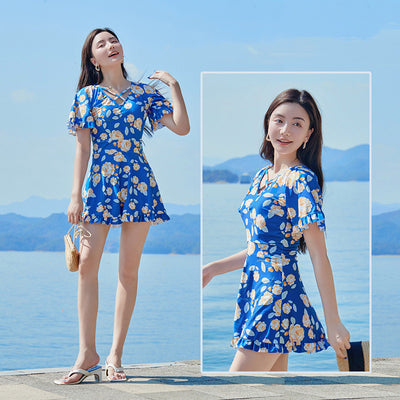 Women's white high-waisted swimsuit with yellow floral print, V-neck, ruffled short sleeves, and ruffled hem. - Image 12