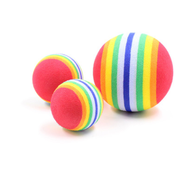 Rainbow striped foam pet toy ball, 6.3cm in diameter, with diagonal bands of red, orange, yellow, green, and blue.
