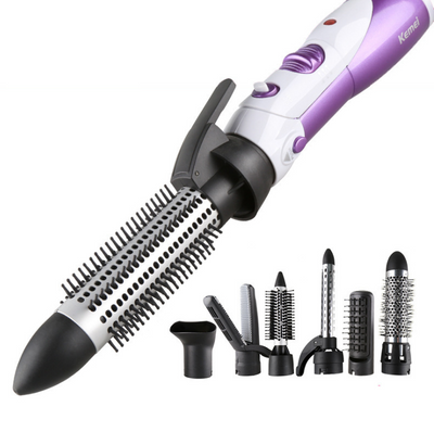 Seven-in-one hair dryer set with white and purple main unit and multiple black styling attachments in an open box. - Image 5