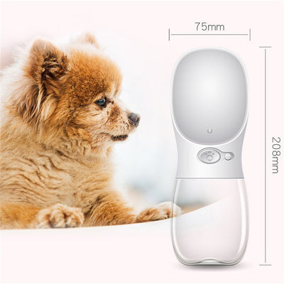 White portable pet water bottle with a clear reservoir and built-in drinking bowl, shown in a bag. - Image 8