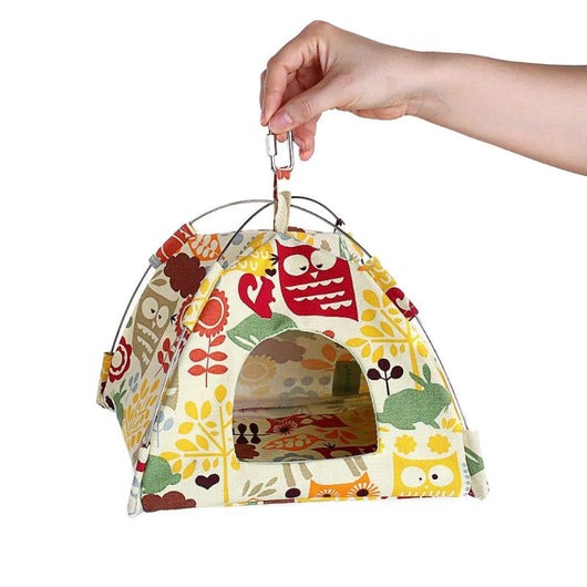 Colorful canvas bird tent with an owl and leaf pattern, featuring a metal frame and hanging hook, next to a cockatiel. - Image 3