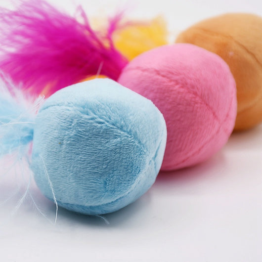 Pink plush ball cat toy with bright fuchsia feathers on top, designed to entice cats for playful interaction. - Image 3