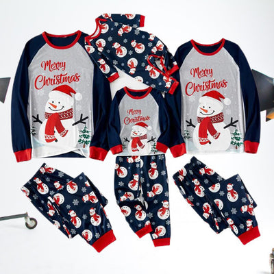 Matching family Christmas pajamas with dark blue long-sleeve tops, light gray fronts, and a snowman graphic. - Image 11
