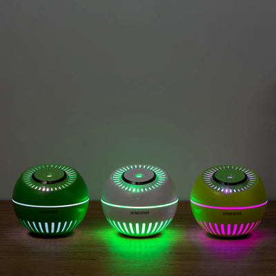 Dark green spherical humidifier with a textured top, control icons, and "HUMIDIFIER" printed on its side. - Image 3