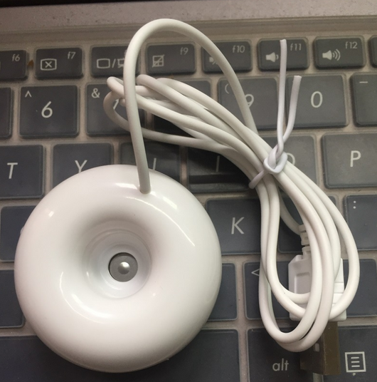 Bright blue donut-shaped mini portable USB air humidifier purifier with a white central filter and silver button. - Image 9