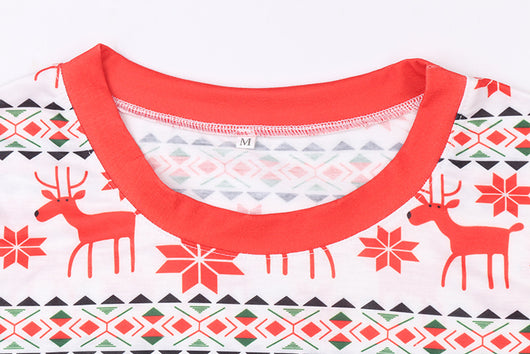 Mother and two daughters in matching red and white reindeer and snowflake print long-sleeve Christmas pajamas. - Image 21