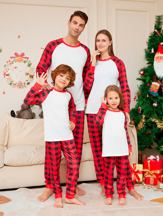 Woman wearing a red and black plaid Christmas pajama set with a white raglan long-sleeve top and matching pants. - Image 11