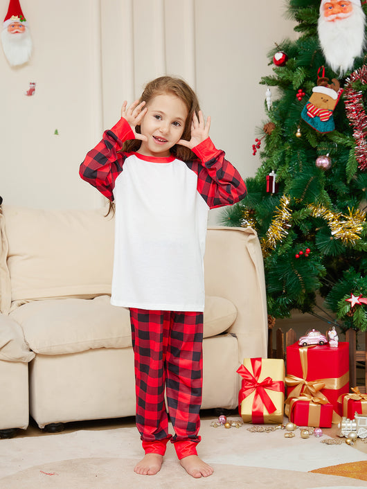 Woman wearing a red and black plaid Christmas pajama set with a white raglan long-sleeve top and matching pants. - Image 15