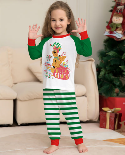 Woman wearing green and white striped holiday pajamas with a Scooby-Doo "Happy Holidays!" graphic on the top. - Image 11