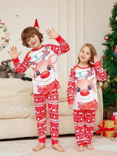 Man wearing a red and white Christmas pajama set with a reindeer graphic and fair isle pattern. - Image 17