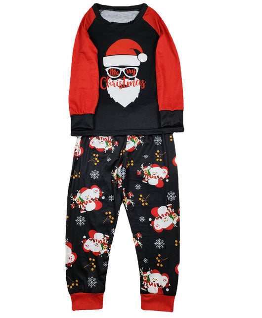 Woman wearing a black and red Christmas pajama set with a Santa Claus graphic top and snowman-patterned pants. - Image 12