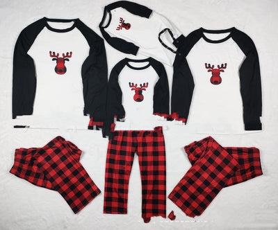 Matching family Christmas pajamas with white long-sleeve tops featuring a red plaid reindeer and red and black buffalo plaid pants. - Image 11