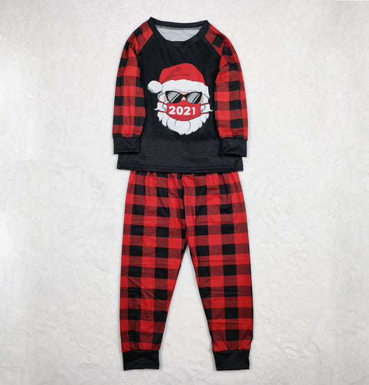Family matching Christmas pajamas with a Santa Claus graphic wearing sunglasses and a '2021' mask, paired with red and black buffalo plaid pants. - Image 9