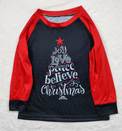 Family matching Christmas pajamas with black tops, red raglan sleeves, 'Joy Love Peace Believe Christmas' graphic, and polar bear print pants. - Image 11