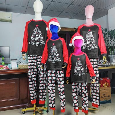 Family matching Christmas pajamas with black tops, red raglan sleeves, 'Joy Love Peace Believe Christmas' graphic, and polar bear print pants. - Image 12