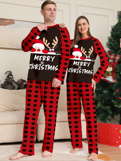 Family of four wearing matching red and black buffalo plaid Christmas pajamas with reindeer graphic. - Image 13