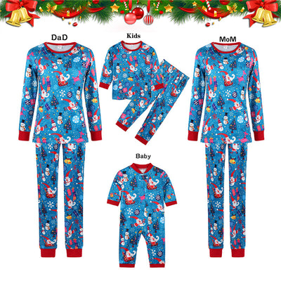 Family matching Christmas pajamas in blue with Santa, snowman, and tree print. Includes adult two-piece sets and a baby romper. - Image 8