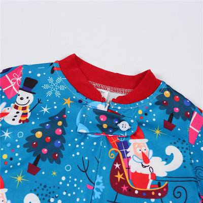 Family matching Christmas pajamas in blue with Santa, snowman, and tree print. Includes adult two-piece sets and a baby romper. - Image 14